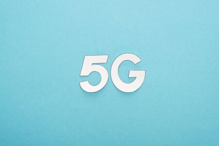 top view of white 5g lettering on blue backgroundの写真素材