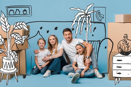 happy parents hugging kids and sitting on blue with cardboard boxes for relocation, interior illustrationの写真素材