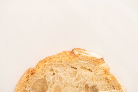 top view of fresh bread slice on white background with copy space