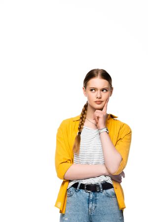 pensive attractive girl with braid thinking and looking away isolated on whiteの写真素材