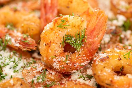 close up view of fried shrimps with dill and grated cheeseの写真素材
