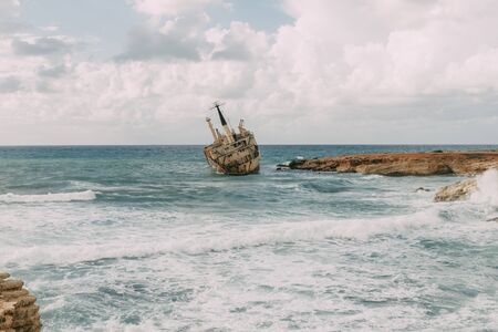 rusty ship in blue water of mediterranean seaの写真素材