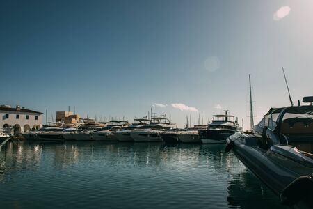docked modern and white yachts in mediterranean seaの写真素材
