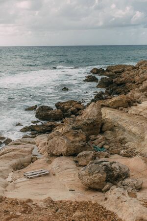 coastline of mediterranean sea against sky with clouds