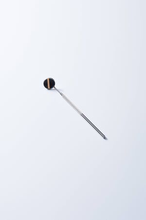 High angle view of dental instrument with mirror for teeth examination on grey backgroundの写真素材