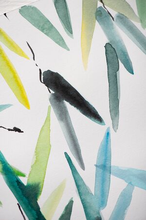 Top view of paper with Japanese painting with multicolored leavesの写真素材