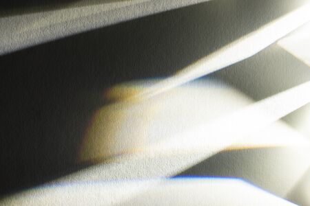 light prism with beams on dark textured backgroundの写真素材