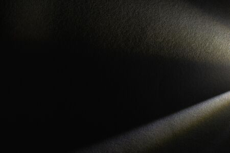 light prism with beams on dark textured backgroundの写真素材
