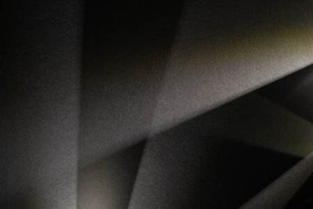 light prism with beams on dark textured backgroundの写真素材
