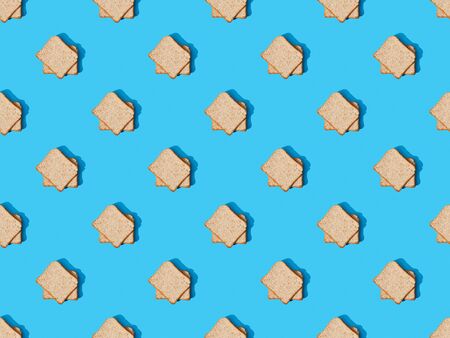 top view of fresh toast bread on blue colorful background, seamless patternの写真素材