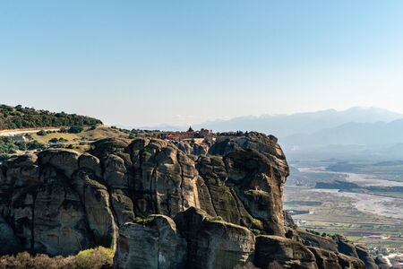 rock formations in mountains against blue sky in greeceの写真素材