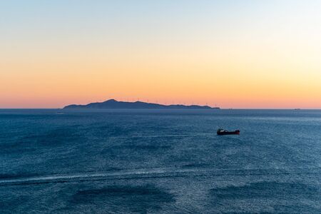 sunset and tranquil aegean sea in greeceの写真素材