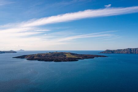 blue aegean sea near greek islands against sky with cloudsの写真素材