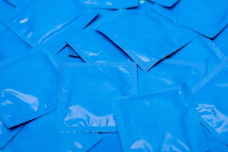 close up of blue packs with condomsの写真素材