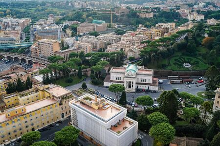 view of vatican city with ancient buildings and green parkの写真素材
