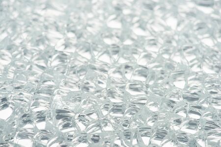 close up view of abstract transparent ice textured background