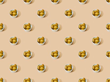 olives in bowls on beige background, seamless pattern