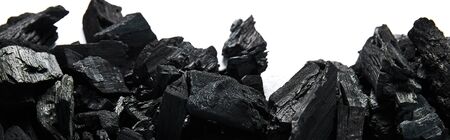 top view of black coals on white background, panoramic shotの写真素材