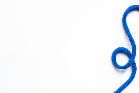 top view of blue wool thread on white backgroundの写真素材