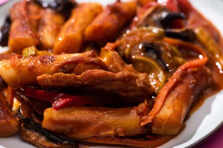close up of delicious and spicy korean topokki in plateの写真素材