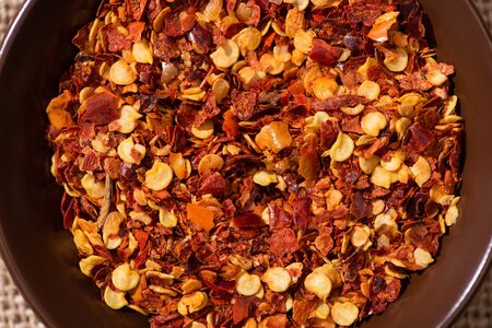 top view of dried and spicy chili peppers in bowl