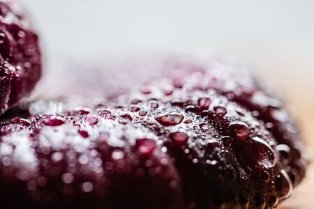 close up view of wet cut onion with water drops