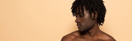 african american shirtless man isolated on beige, panoramic cropの写真素材
