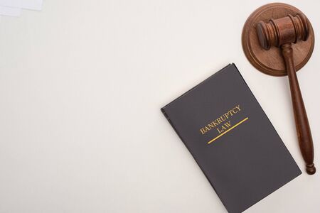 top view of bankruptcy law book and gavel on white backgroundの写真素材