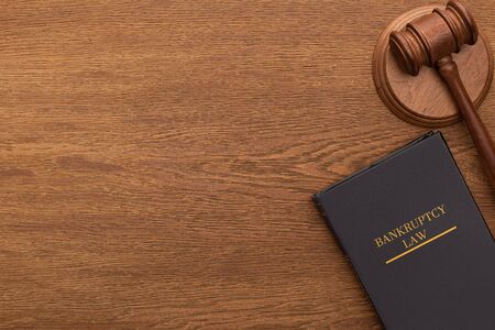 top view of bankruptcy law book and gavel on wooden backgroundの写真素材