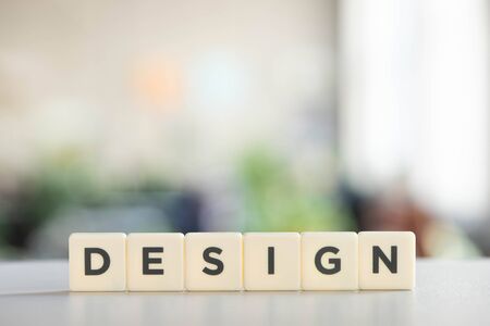 white cubes with design inscription on office deskの写真素材