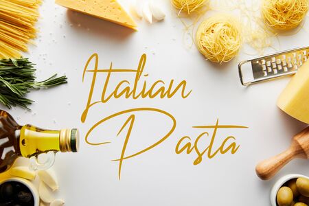 Top view of rolling pin, grater, bottle of olive oil, pasta and ingredients on white background, italian pasta illustrationの写真素材