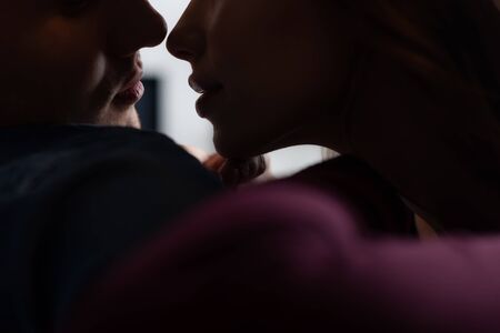 cropped view of man and woman in living room