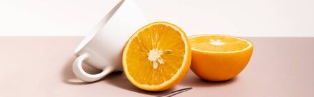 fruit composition with cut orange, cup isolated on beige, panoramic cropの写真素材