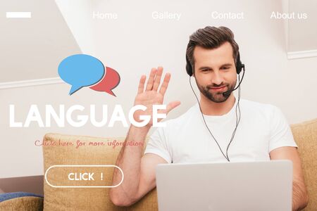 Selective focus of smiling teleworker in headset waving hand during video chat on laptop at home,...