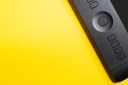 top view of drawing tablet on yellow