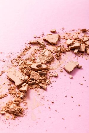 beige and crushed face powder on pinkの写真素材