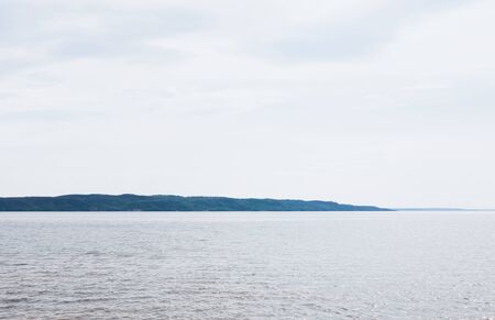 tranquil and blue sea against sky with clouds