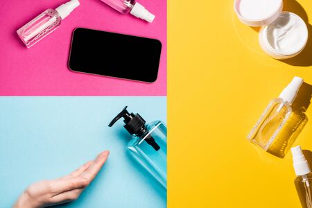 collage of female hand near sanitizer, hand cream and smartphone near antiseptic liquid on...