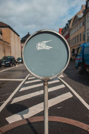 Empty signboard on road on urban street in Copenhagen, Denmarkの写真素材