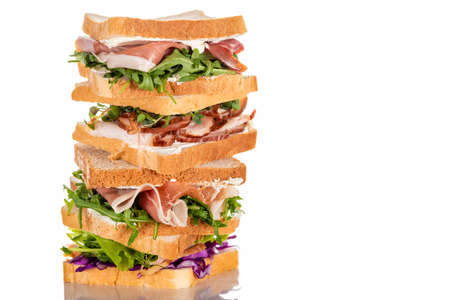 fresh sandwiches with arugula and meat on white surfaceの写真素材