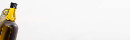 top view of olive oil in bottle on white background, panoramic orientationの写真素材