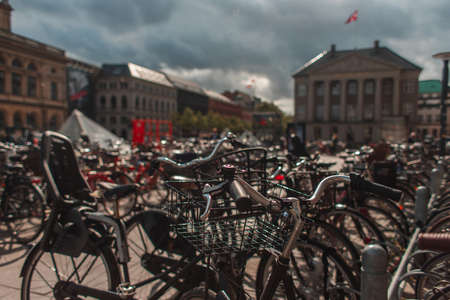 Selective focus of bicycles with sunlight on urban street in Copenhagen, Denmarkの写真素材