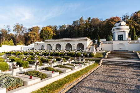LVIV, UKRAINE - OCTOBER 23, 2019: graveyard with crosses and lettering near green trees on lviv defenders cemeteryのeditorial素材