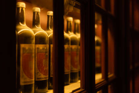 LVIV, UKRAINE - OCTOBER 23, 2019: selective focus of bottles with wine and cyrillic lettering on...
