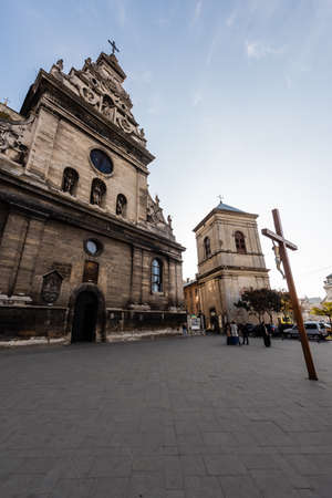 LVIV, UKRAINE - OCTOBER 23, 2019: crucifix in front of st andrews catholic churchのeditorial素材