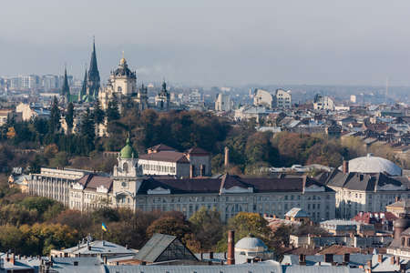 LVIV, UKRAINE - OCTOBER 23, 2019: aerial view of city hall and dominican church in historical center of cityのeditorial素材
