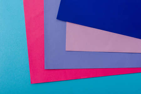 abstract geometric background with pink, blue and violet paperの写真素材