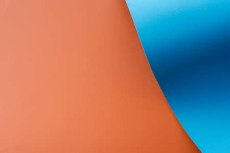 blue colorful wavy paper on orange backgroundの写真素材