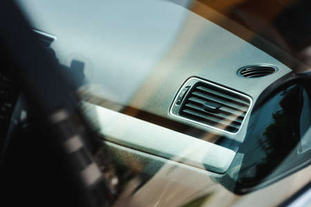 Selective focus of regulator of ventilation system on dashboard in carの写真素材
