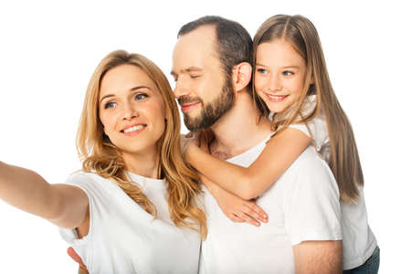 happy family in white t-shirts embracing isolated on white